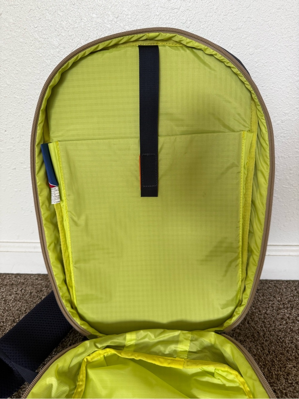 cotopaxi Black Sling Backpack with Blue Piping and Red Zip Pull - Picture 9 of 10